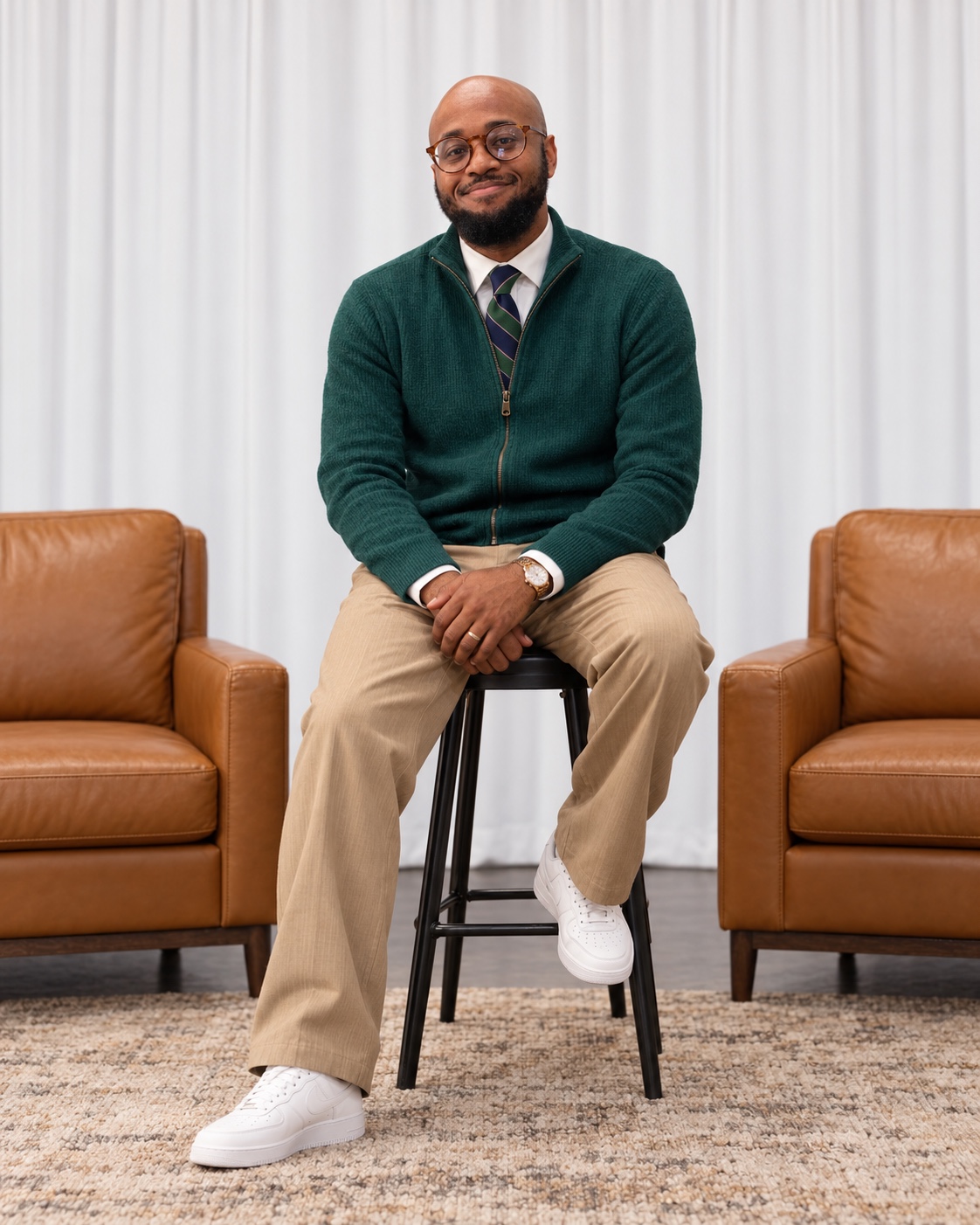 Aaron R. Young in a seated professional portrait